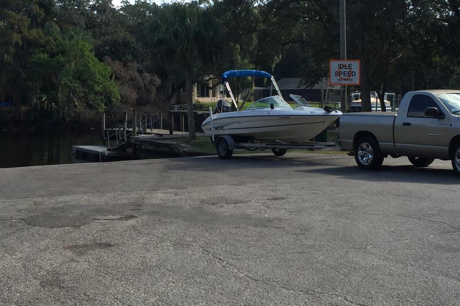 View of boat on trailer at boat ramp